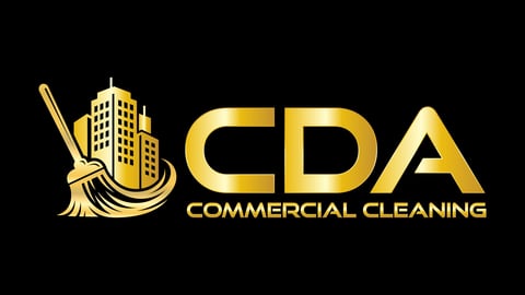 CDA Commercial Cleaning logo featuring a broom and building icon in gold on black background